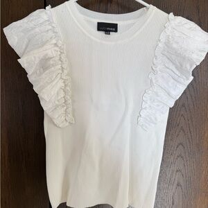 White ruffle blouse